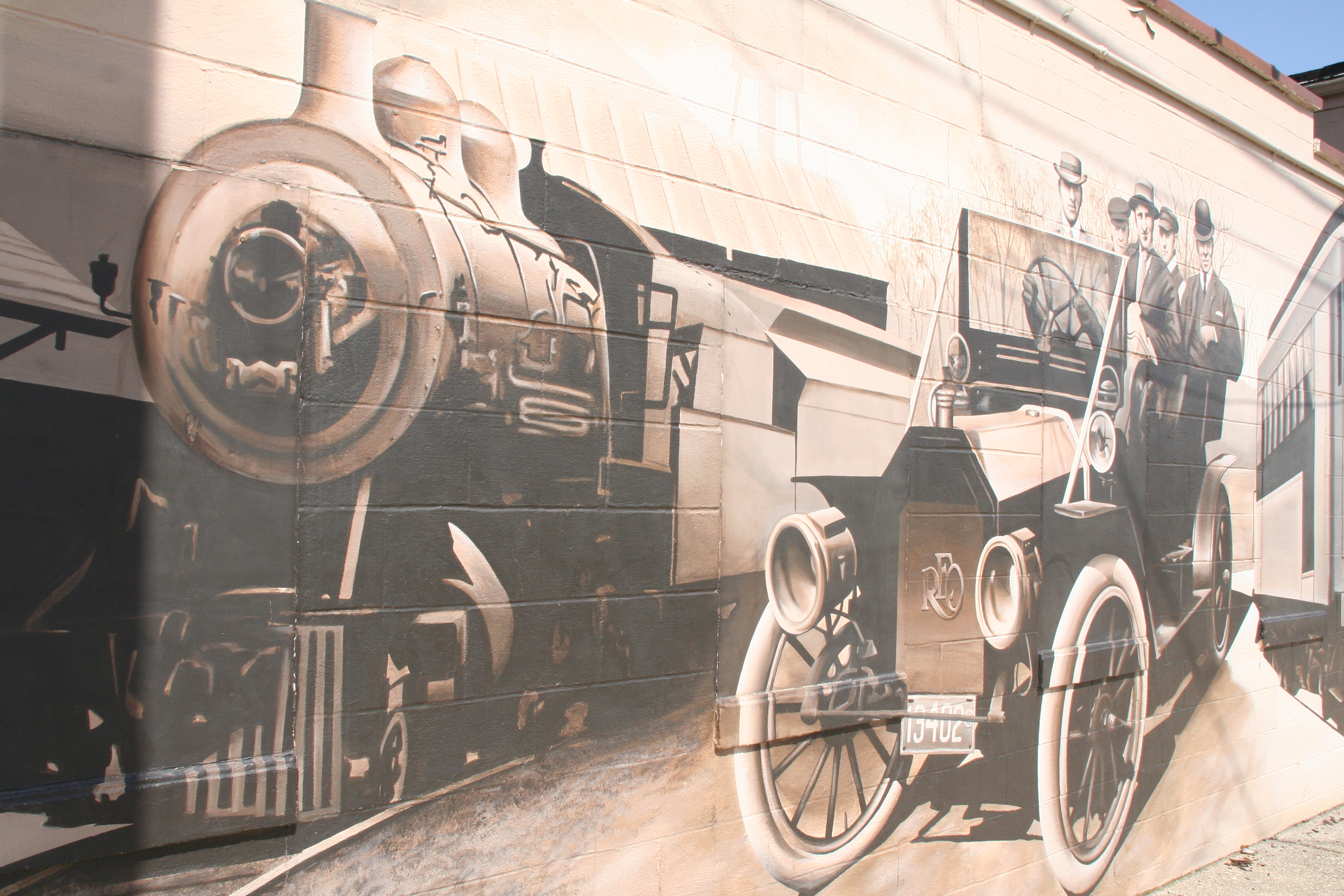 Train and old car on the mural